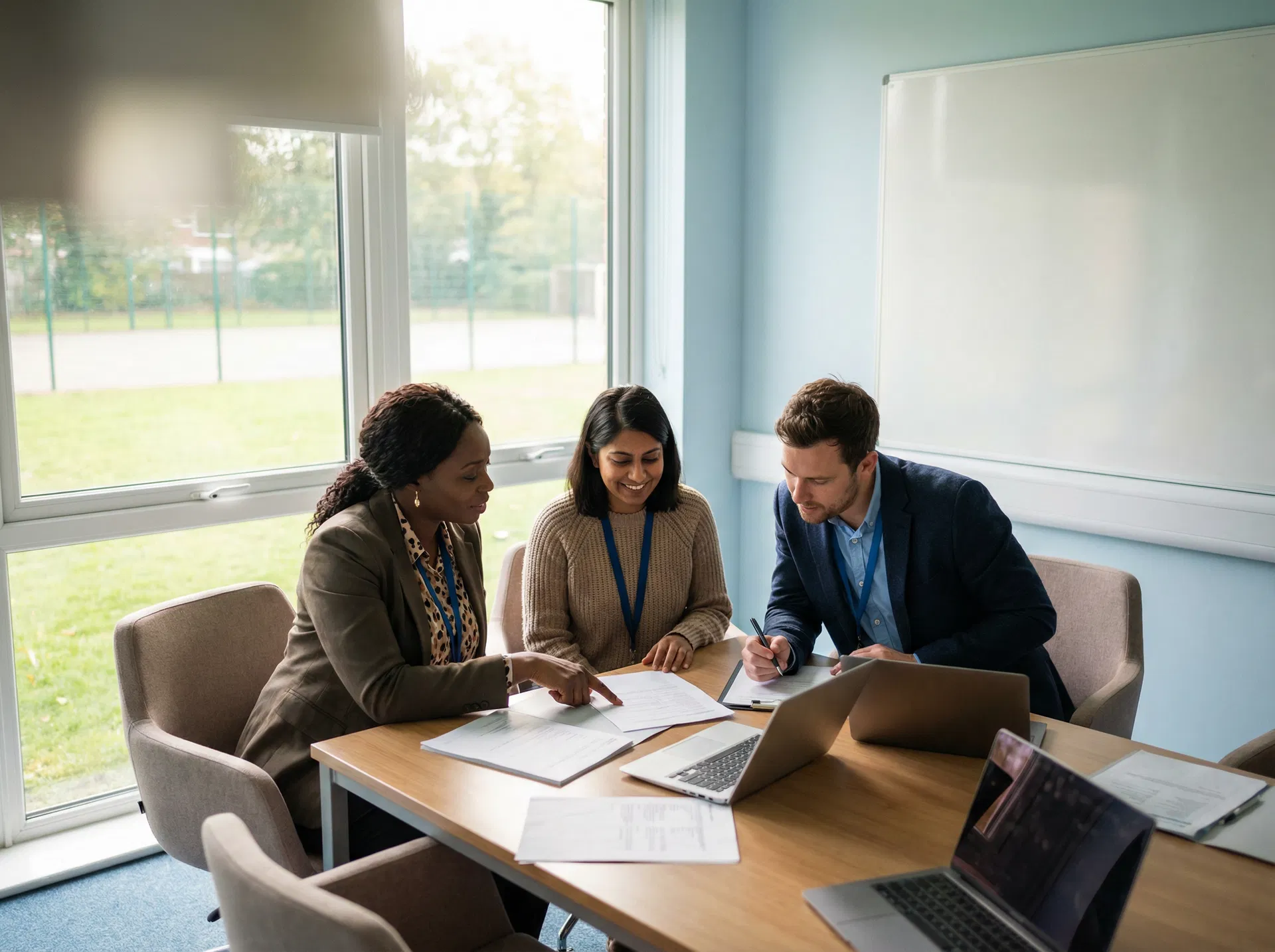 School staff collaborating on incident reports