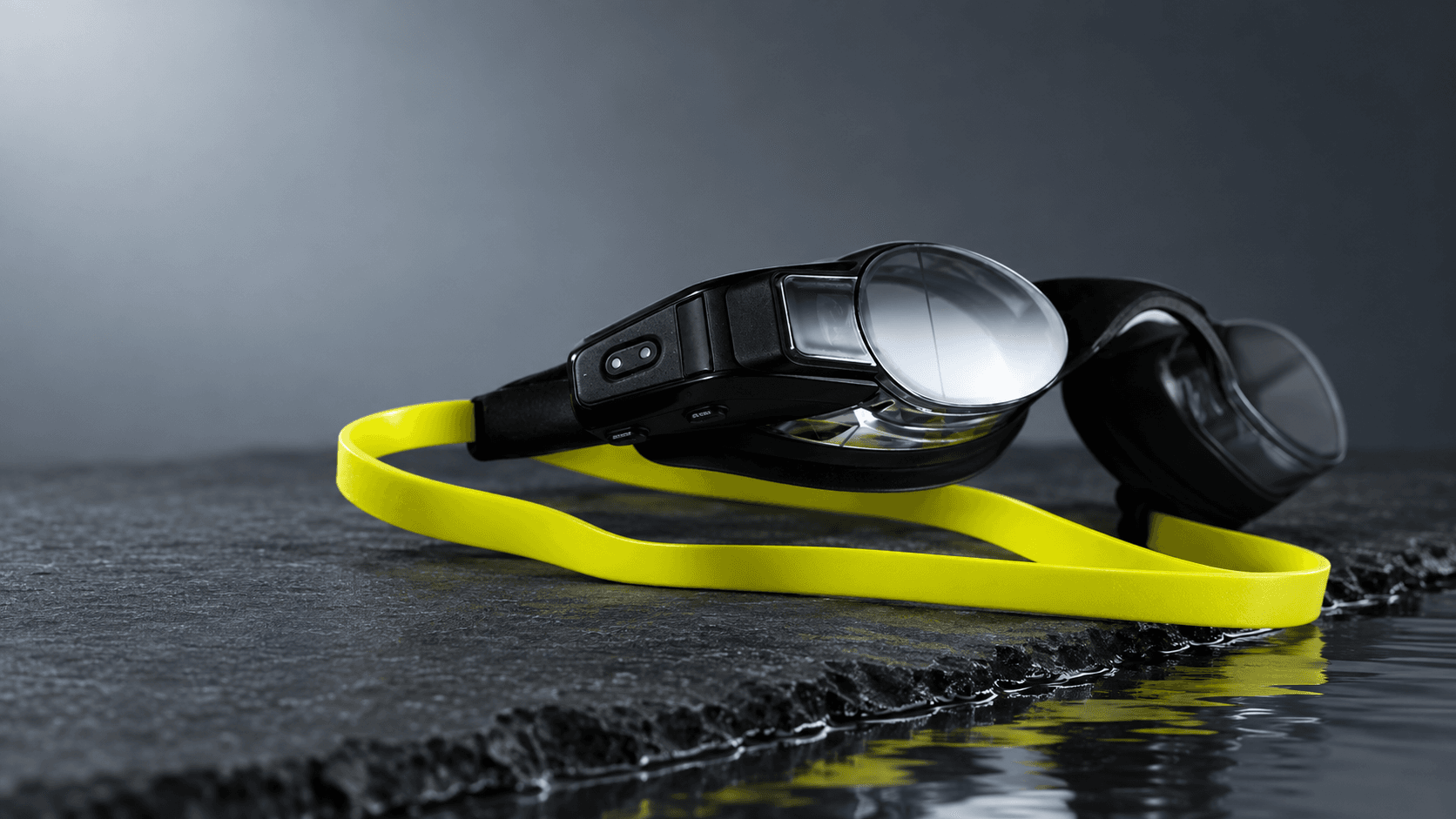 FORM Smart Swim 2 LT swim goggles on a dark slate editorial surface
